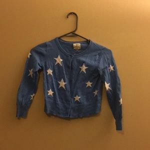 Girl’s blue cardigan sweater